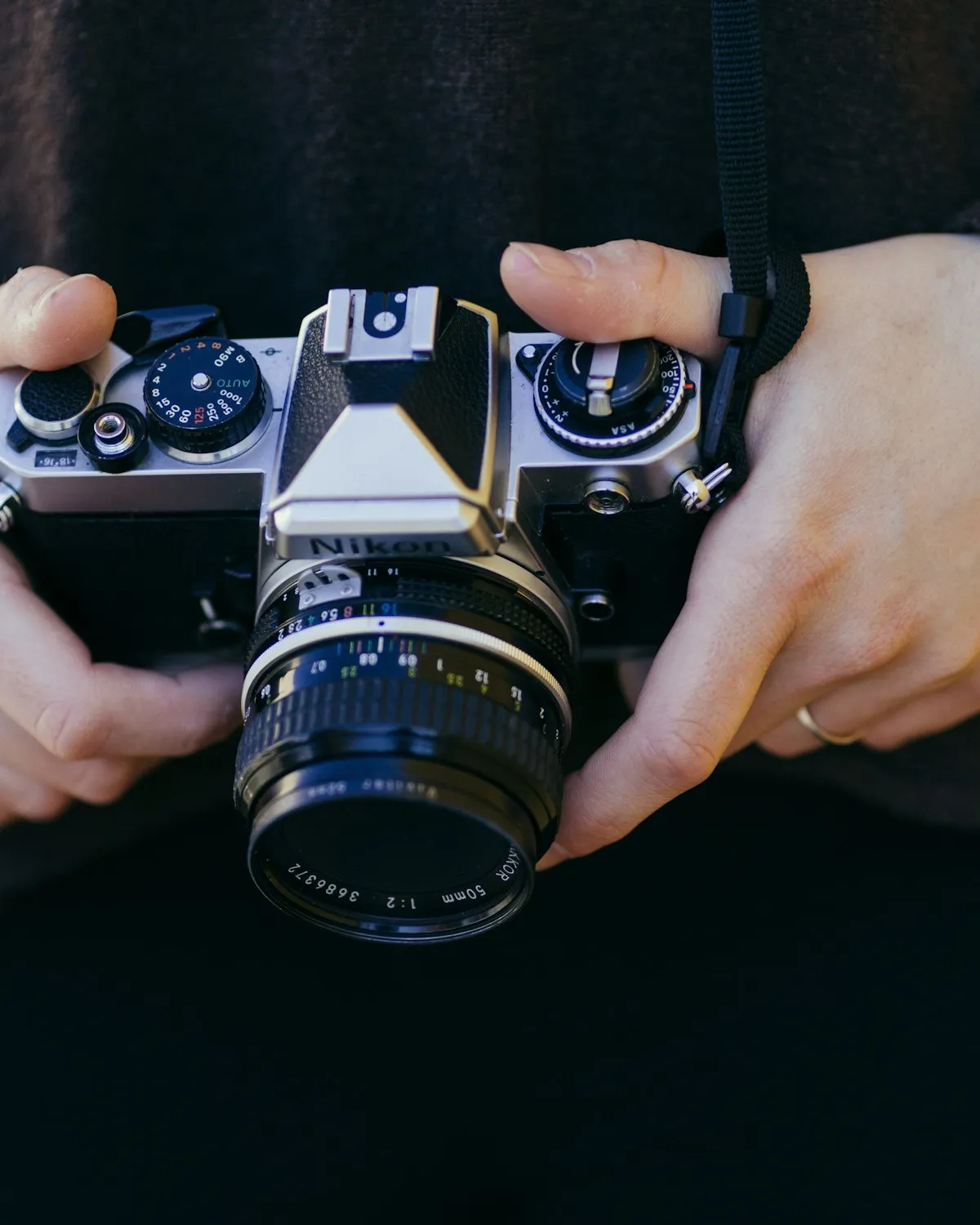 Hands holding a vintage film camera